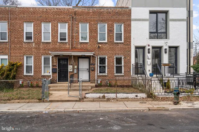 a front view of a building with street view