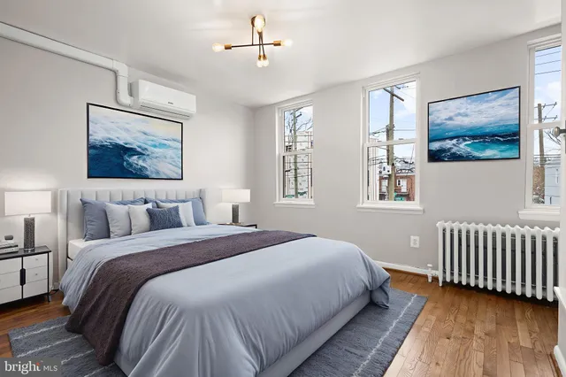 a bedroom with a large bed and a window