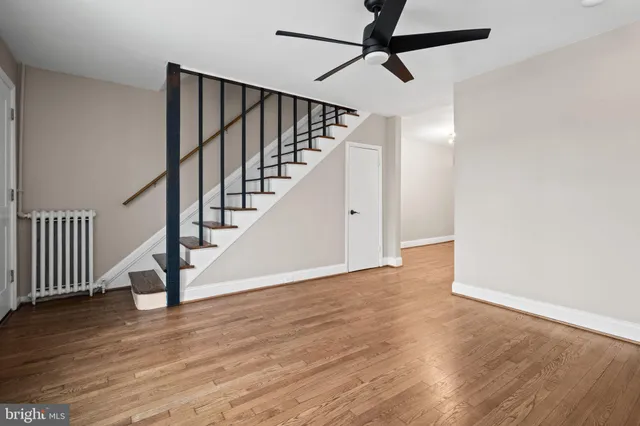 a view of an entryway with wooden floor