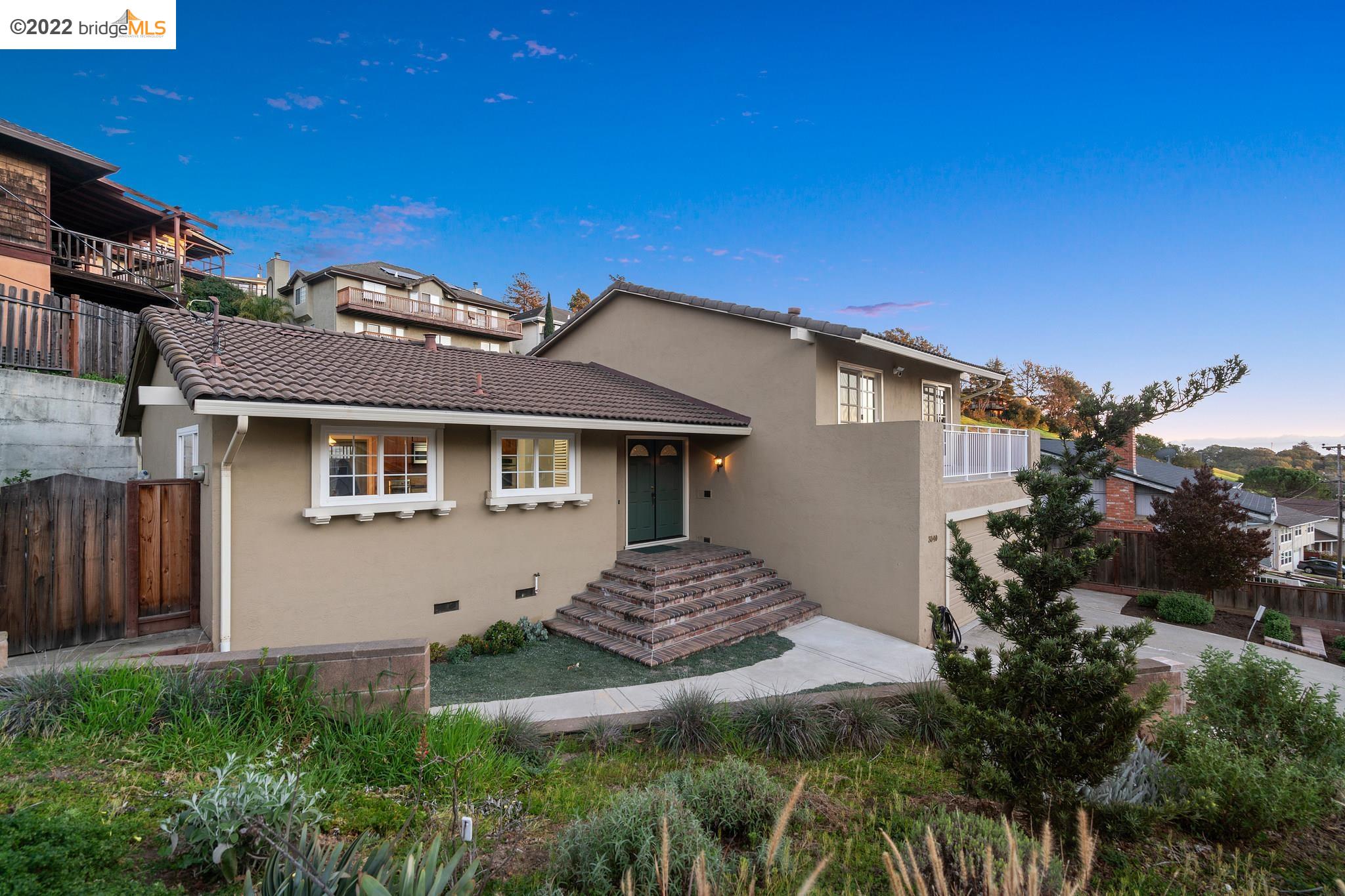 3940 Malcolm Avenue Oakland, CA 94605 - Photo 1 of 1 a front view of a house with a garden