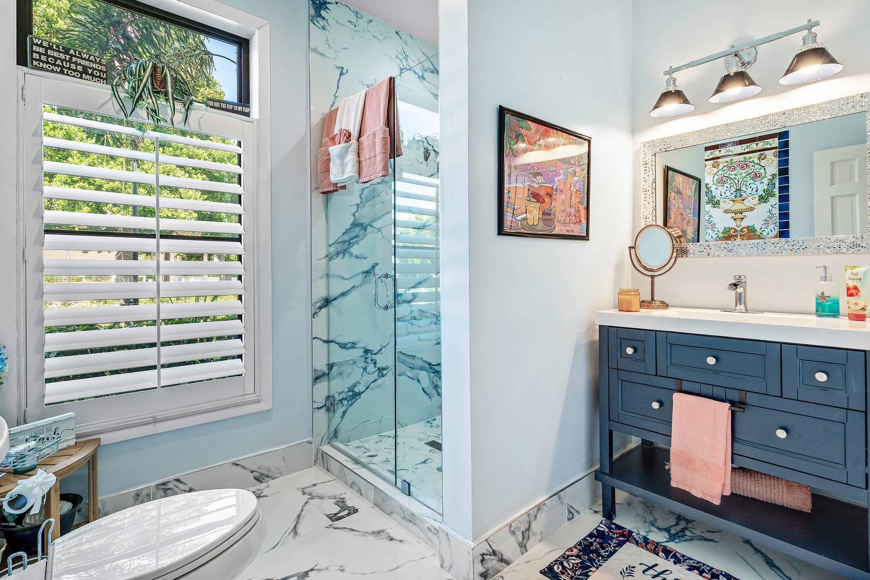 19 East Ocean Avenue Ocean Ridge, FL 33435 - Photo 16 of 24 a bathroom with a granite countertop sink toilet and shower
