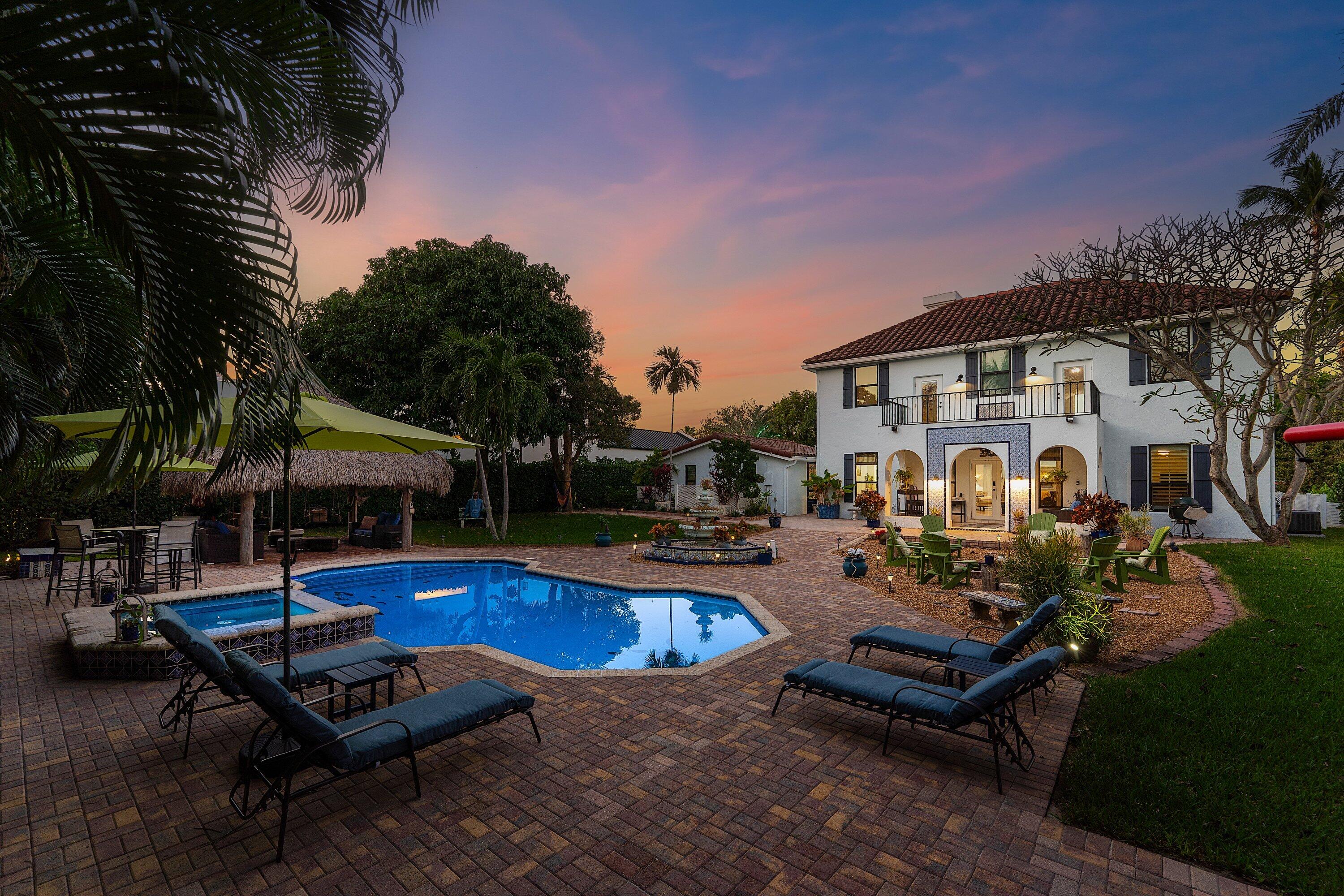 19 East Ocean Avenue Ocean Ridge, FL 33435 - Photo 24 of 24 a swimming pool with outdoor seating and yard in the back