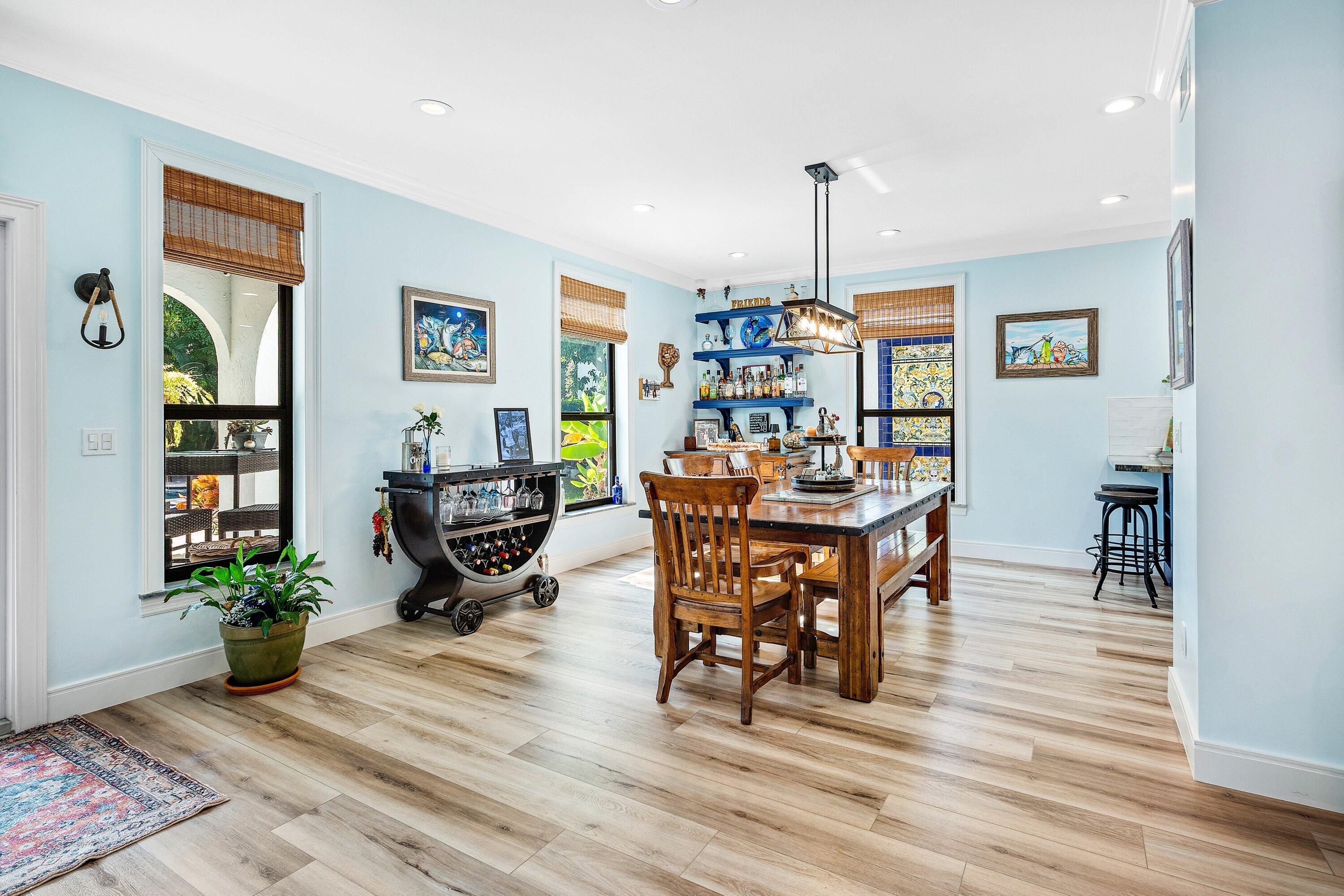 19 East Ocean Avenue Ocean Ridge, FL 33435 - Photo 7 of 24 a dining room filled with furniture and wooden floor