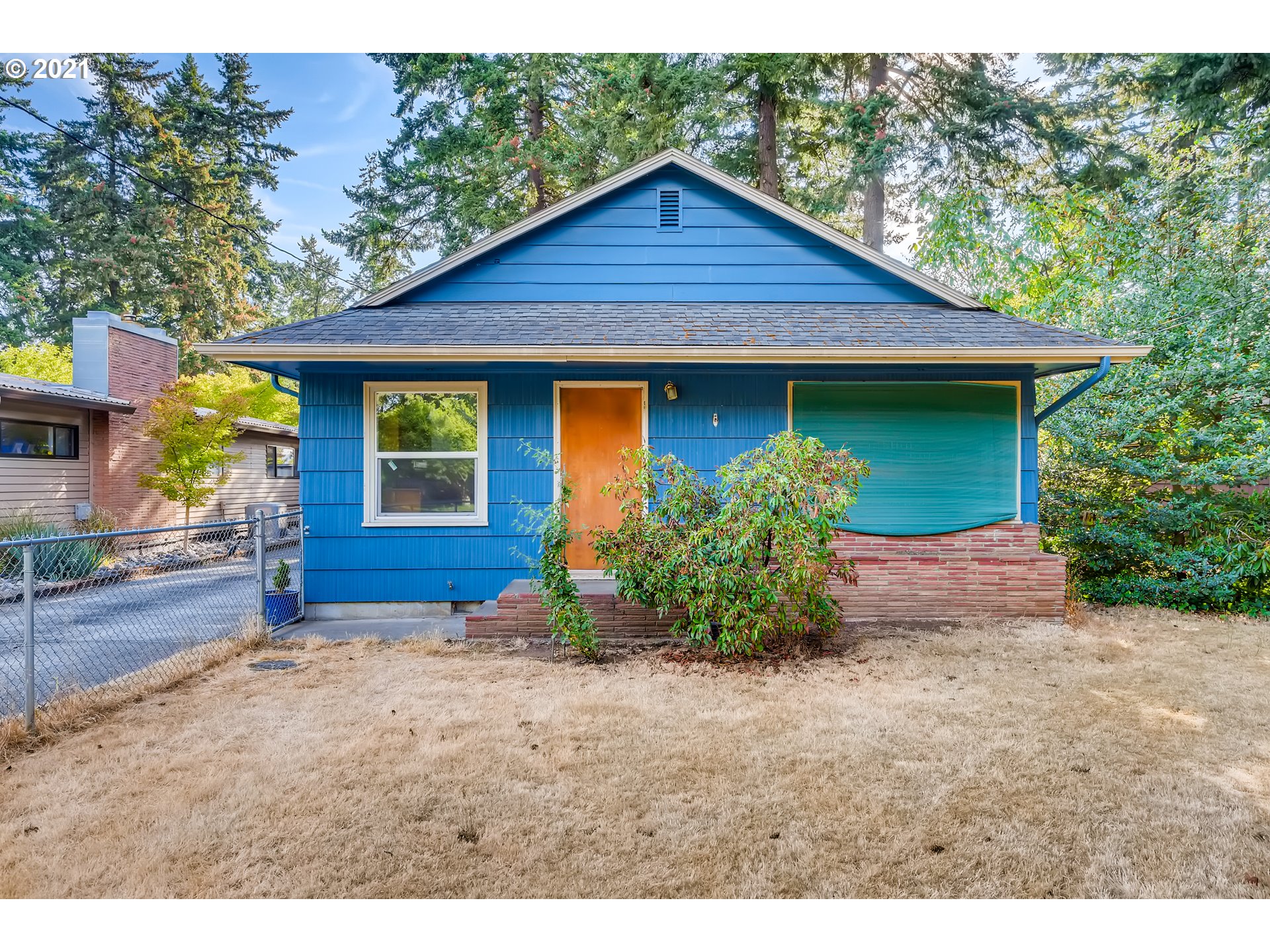 a front view of a house with garden
