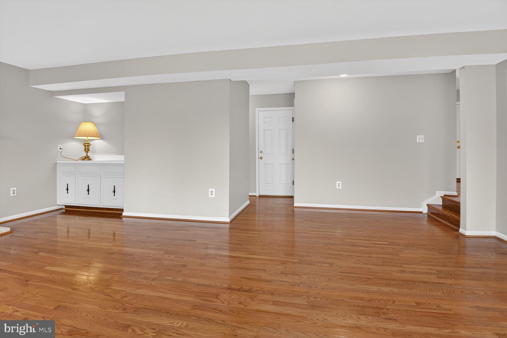 7140 Hamor Lane Springfield, VA 22153 - Photo 12 of 29 a view of an empty room and wooden floor