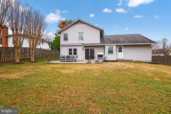 a front view of house with yard and seating area