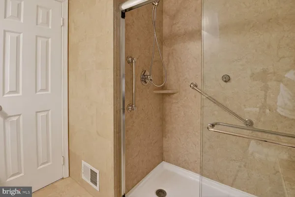 a bathroom with a sink and a shower