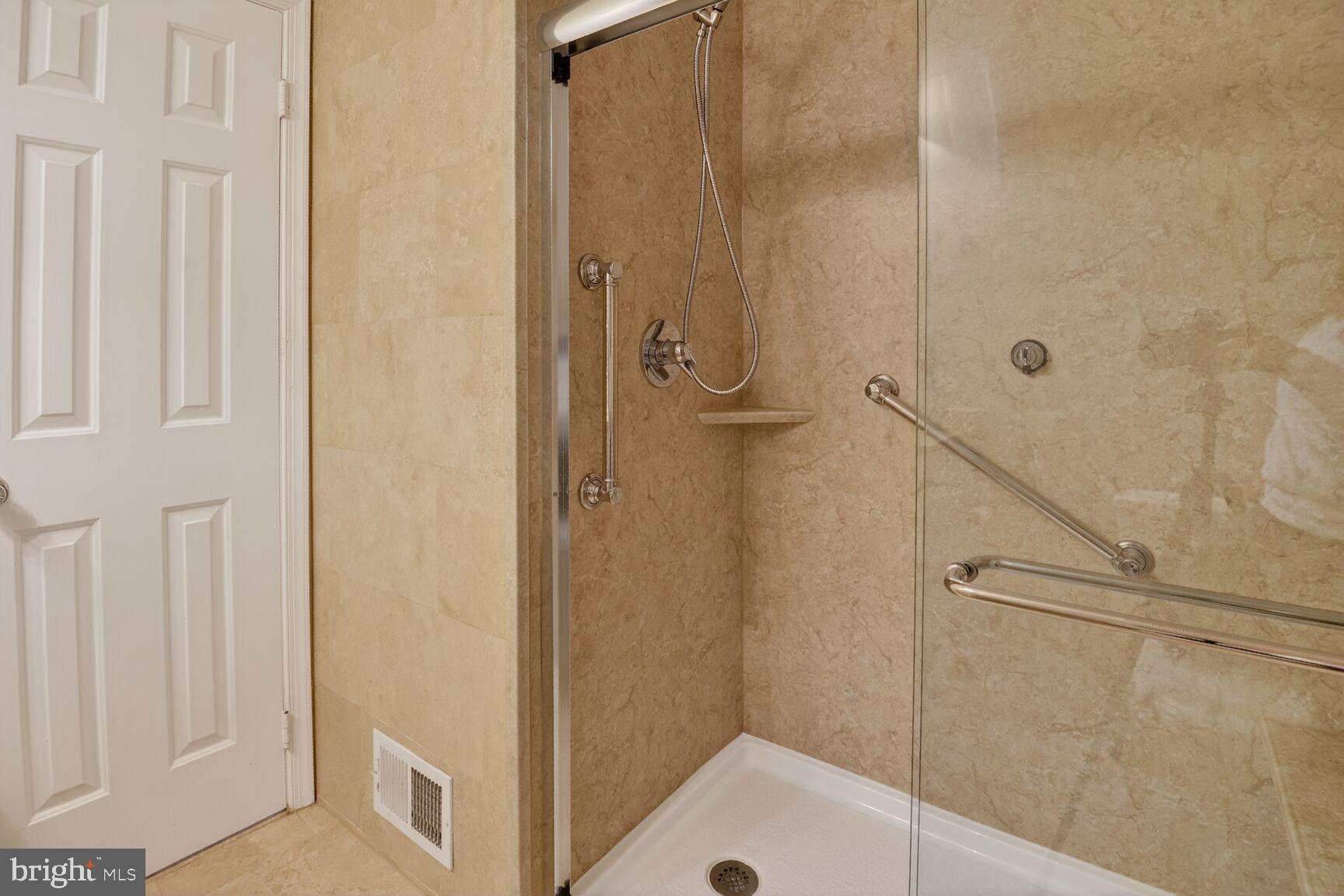 7140 Hamor Lane Springfield, VA 22153 - Photo 21 of 29 a bathroom with a sink and a shower