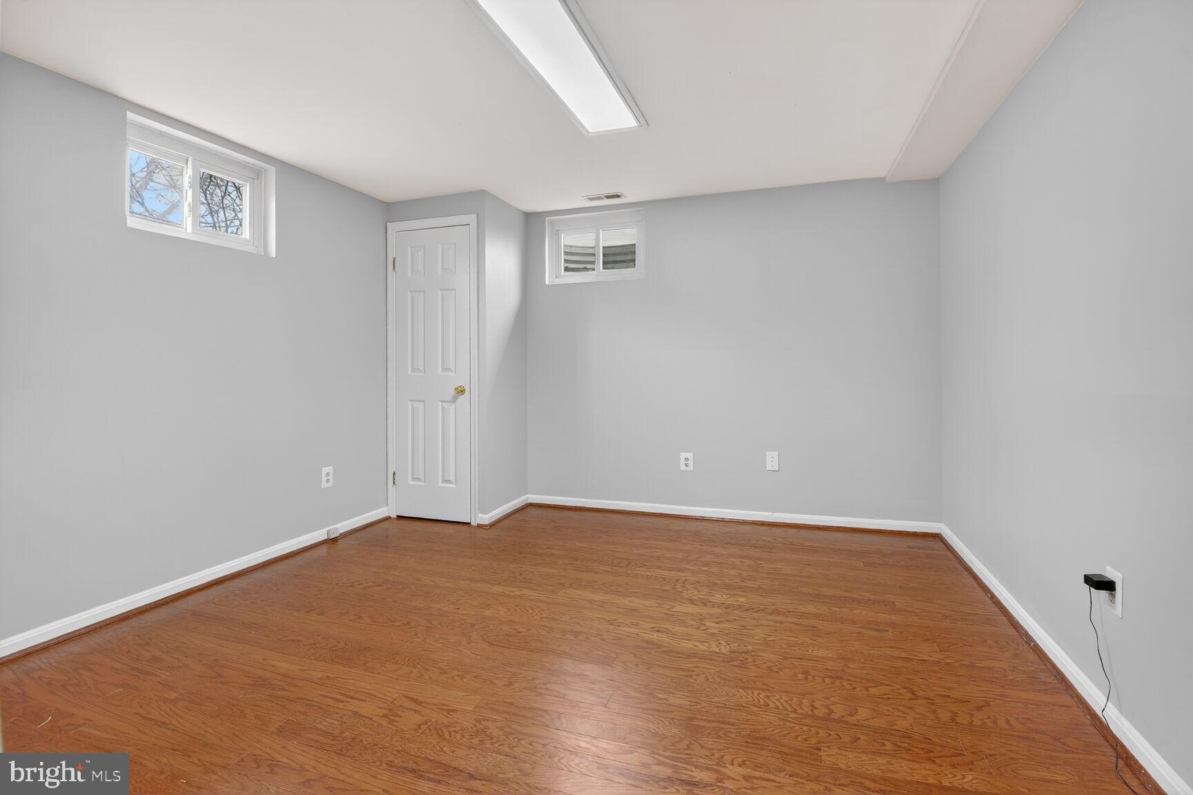 7140 Hamor Lane Springfield, VA 22153 - Photo 28 of 29 a view of an empty room with wooden floor