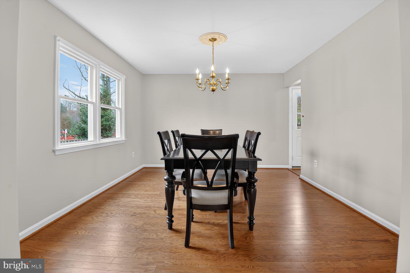 7140 Hamor Lane Springfield, VA 22153 - Photo 6 of 29 a view of a dining room with furniture window and wooden floor