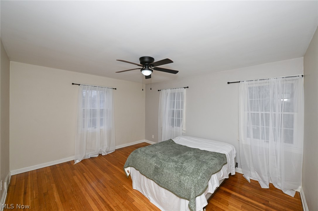 3699 Bainbridge Road Cleveland Heights, OH 44118 - Photo 26 of 37 Room featuring wood-finish flooring, white baseboards, and neutral wall tones
