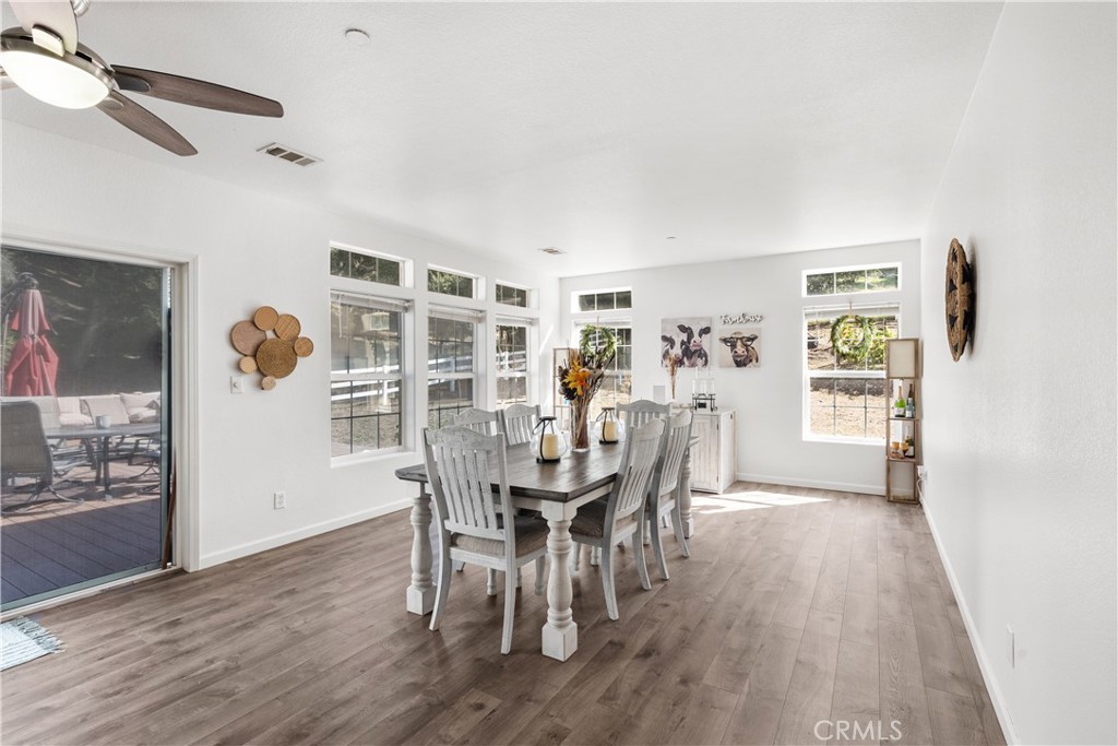 31053 Hasley Canyon Road Castaic, CA 91384 - Photo 13 of 50 a view of a dining room with furniture and wooden floor