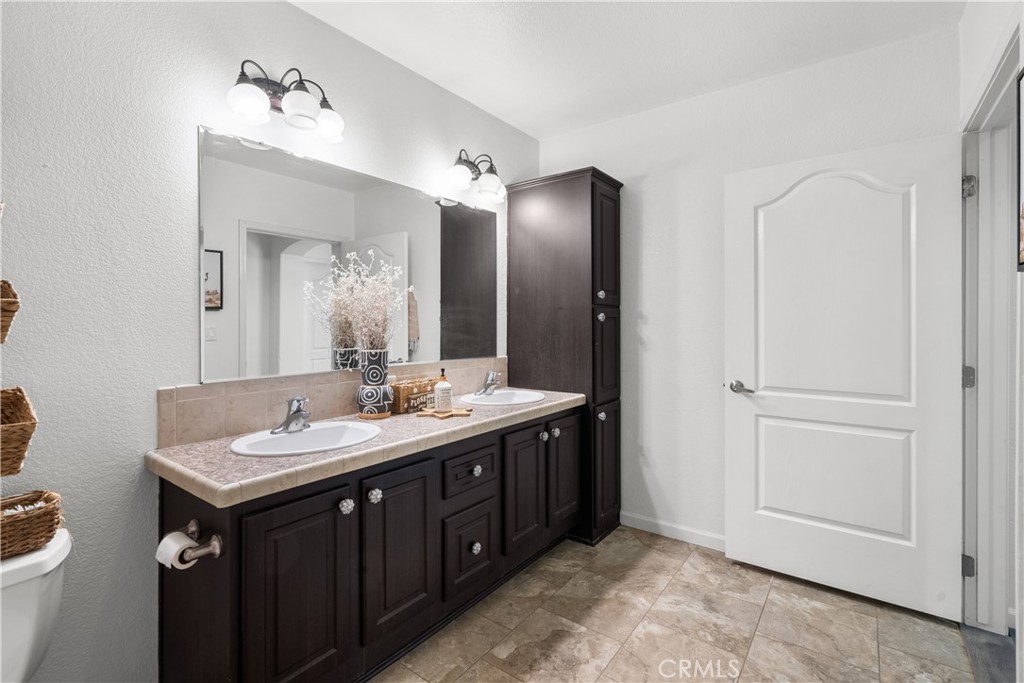 31053 Hasley Canyon Road Castaic, CA 91384 - Photo 21 of 50 a bathroom with a sink and a mirror