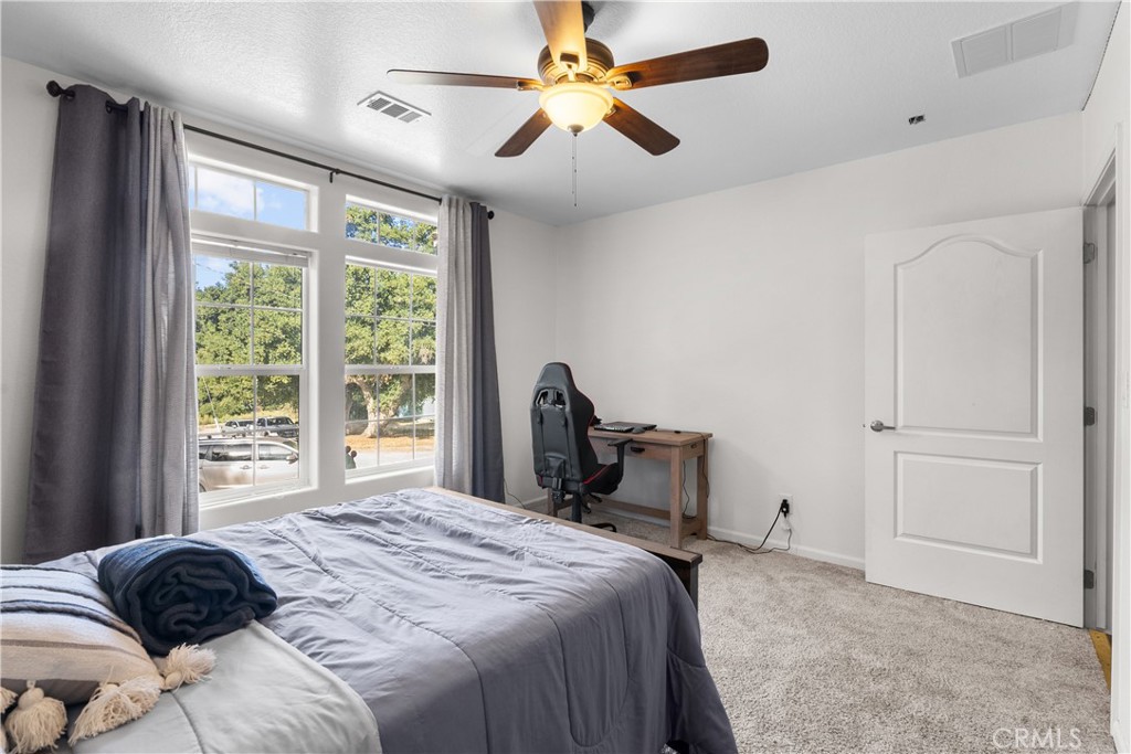 31053 Hasley Canyon Road Castaic, CA 91384 - Photo 27 of 50 a bedroom with a bed and a large window