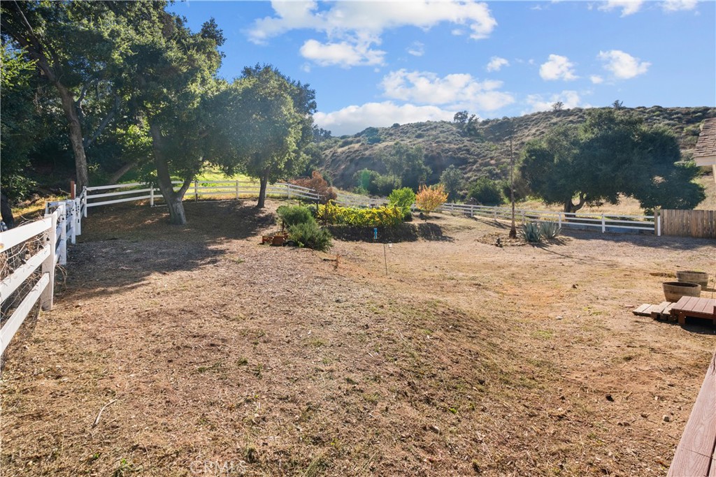 31053 Hasley Canyon Road Castaic, CA 91384 - Photo 33 of 50 a view of a park with lawn chairs and a fire pit
