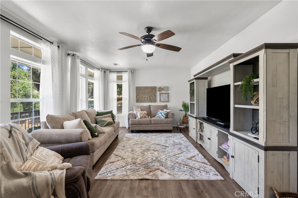 31053 Hasley Canyon Road Castaic, CA 91384 - Photo 6 of 50 a living room with furniture and a flat screen tv