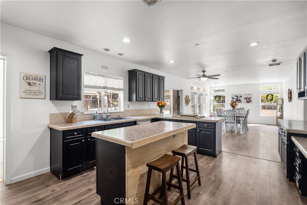 31053 Hasley Canyon Road Castaic, CA 91384 - Photo 10 of 50 a kitchen with a sink a counter top space and stainless steel appliances
