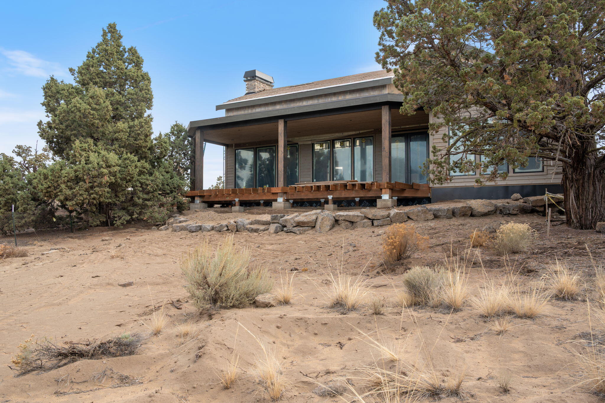 22936 Ghost Tree Lane Bend, OR 97701 - Photo 36 of 74 a view of house with a yard and sitting area