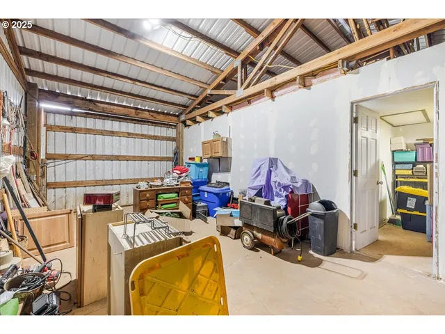 a view of a yard with an ocean and trees
