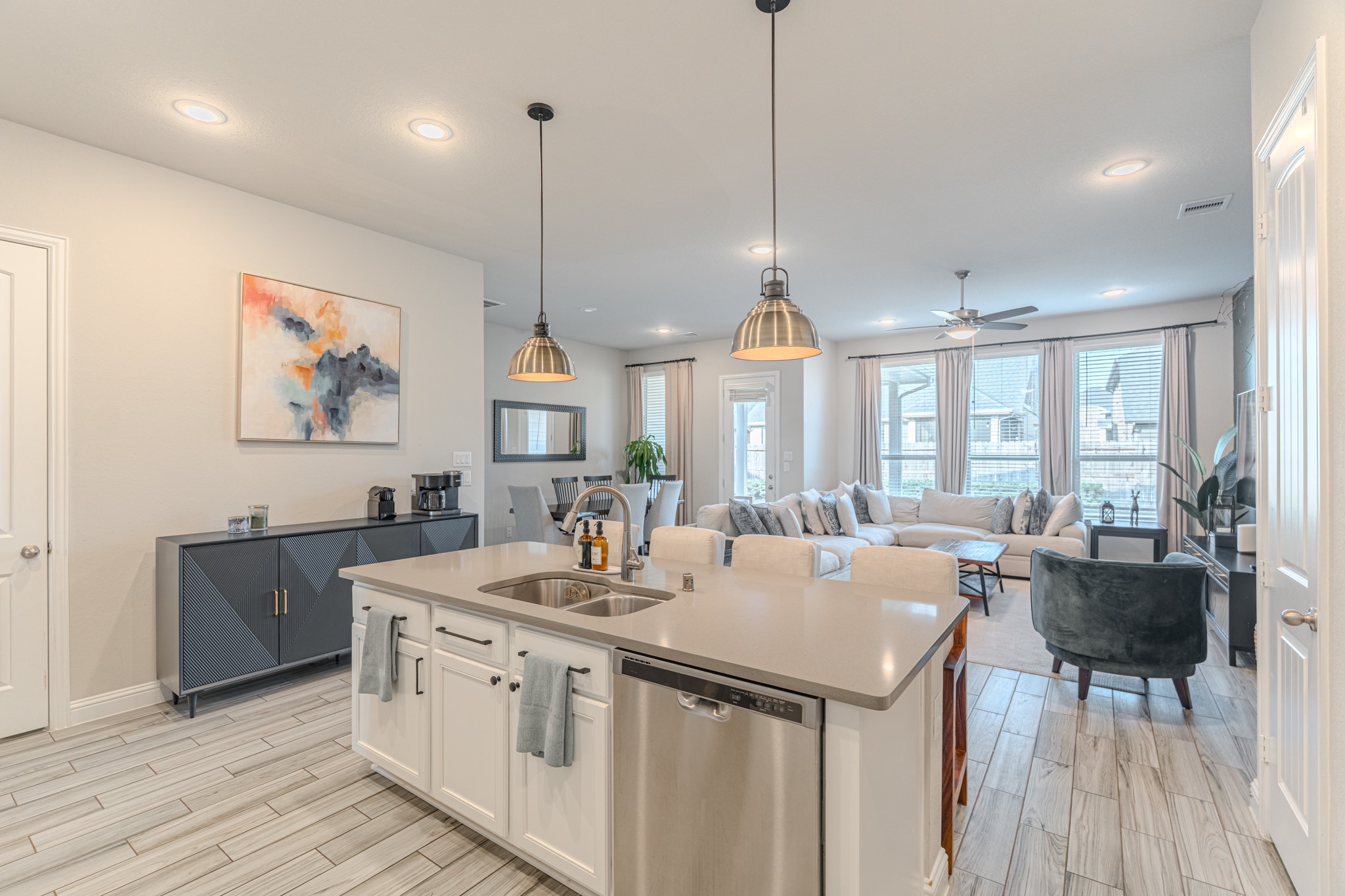 17310 Autumn Sage Court Conroe, TX 77385 - Photo 12 of 31 a kitchen with granite countertop a sink a counter space appliances and cabinets