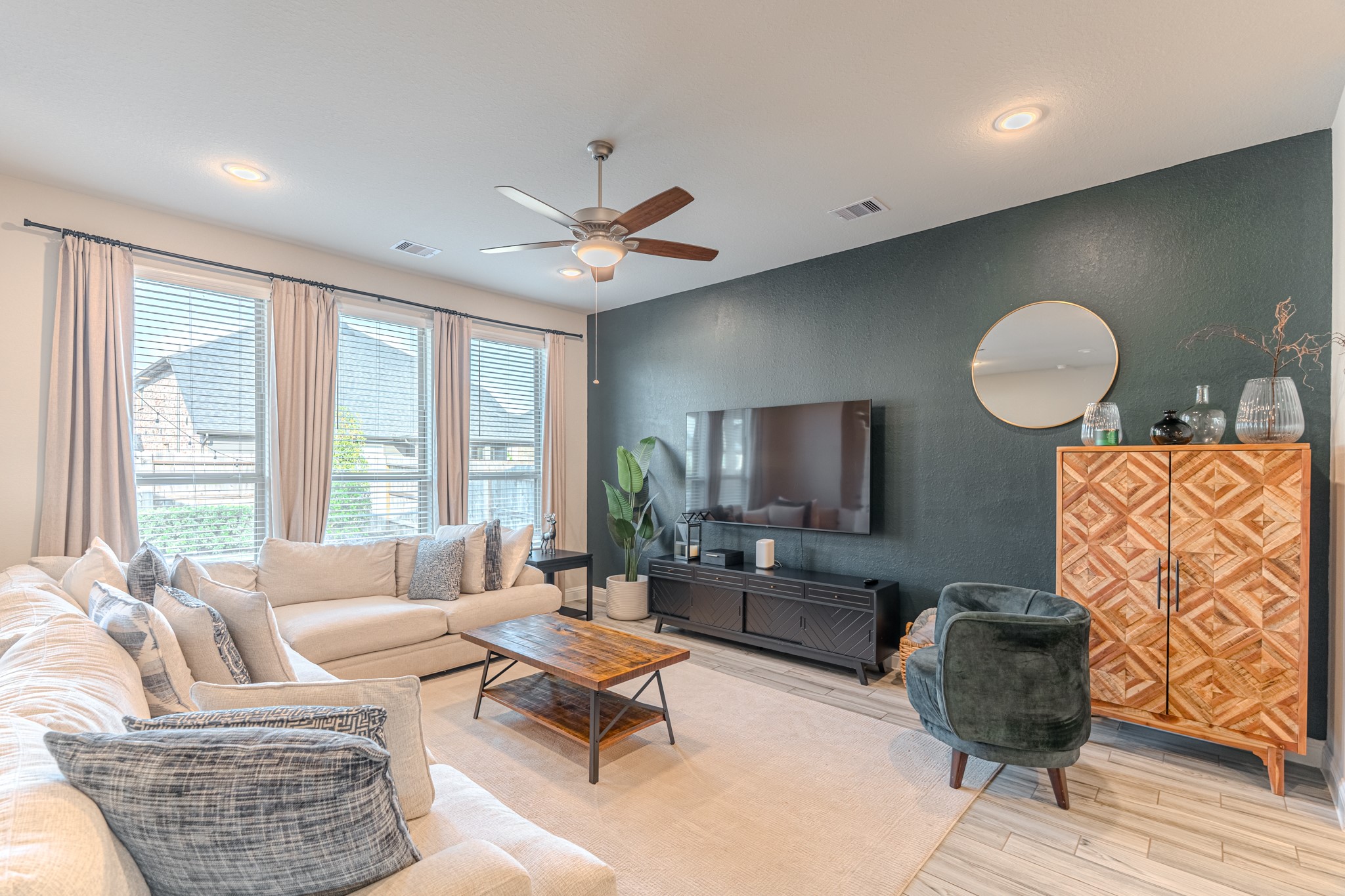 17310 Autumn Sage Court Conroe, TX 77385 - Photo 13 of 31 a living room with furniture and a large window