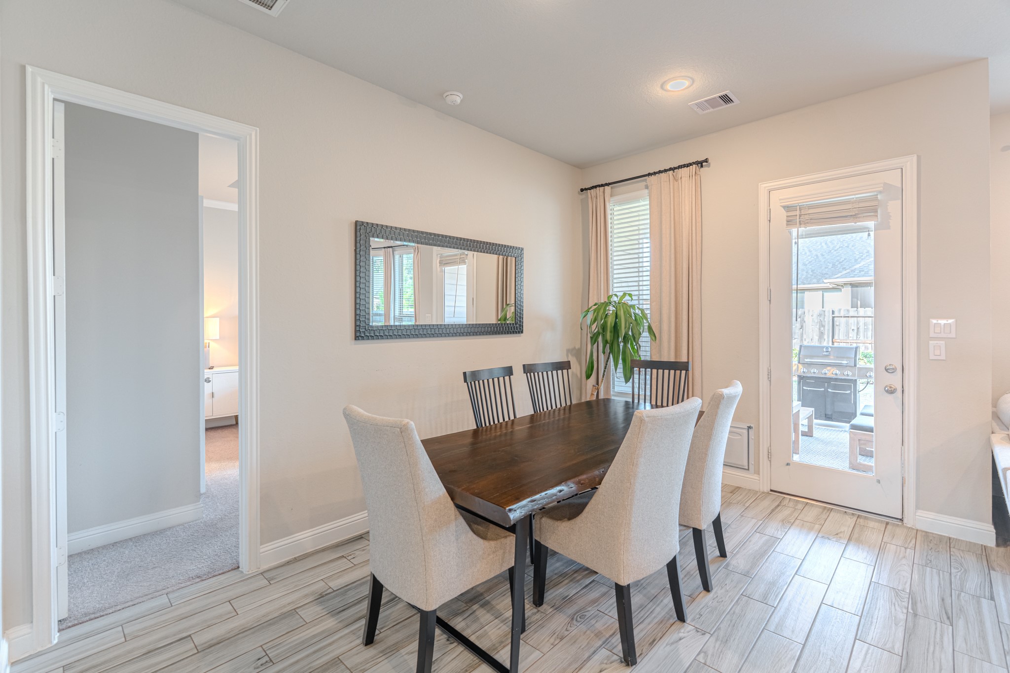 17310 Autumn Sage Court Conroe, TX 77385 - Photo 17 of 31 a view of a dining room with furniture and wooden floor