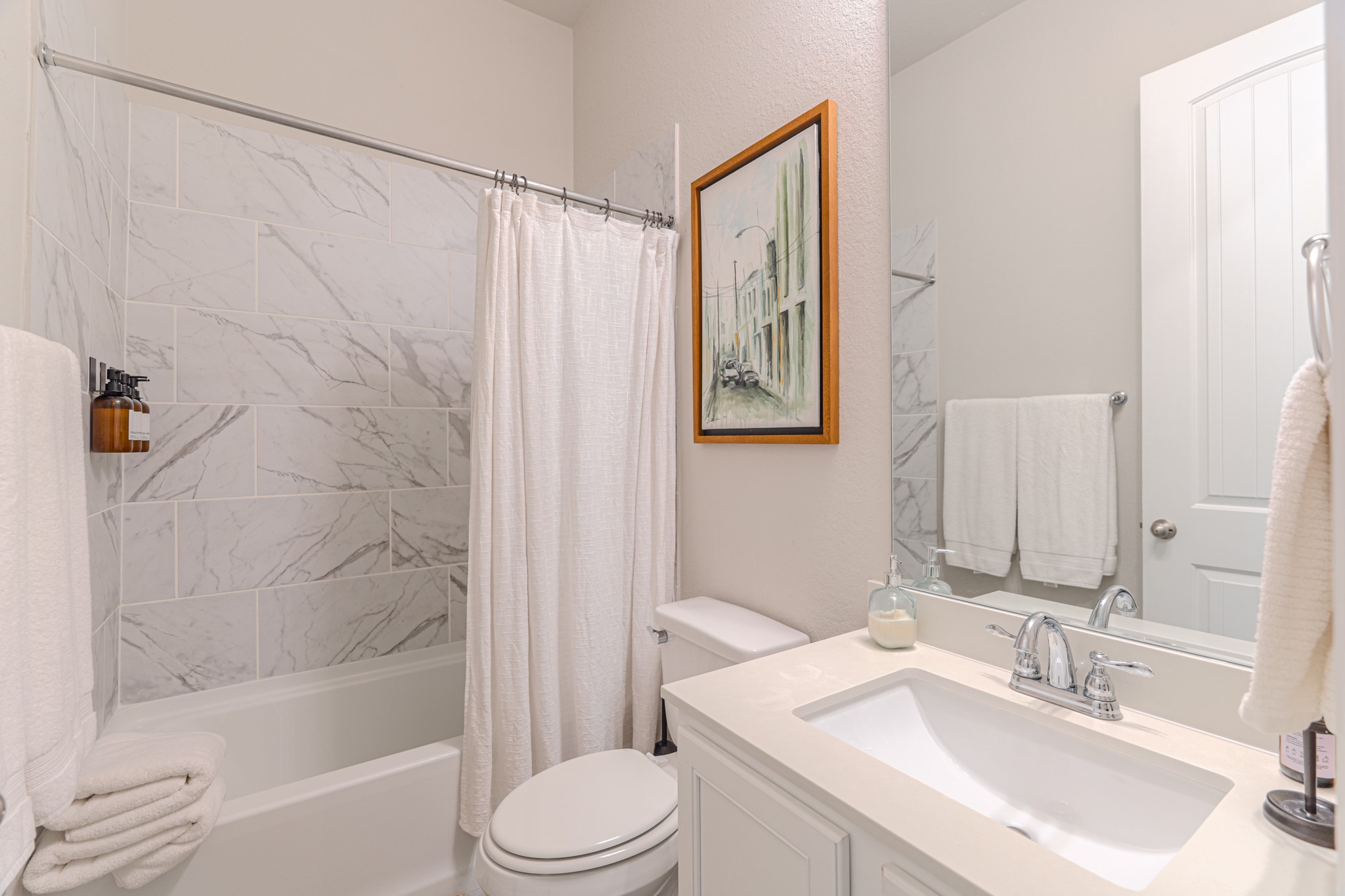 17310 Autumn Sage Court Conroe, TX 77385 - Photo 26 of 31 a bathroom with a sink a toilet and shower