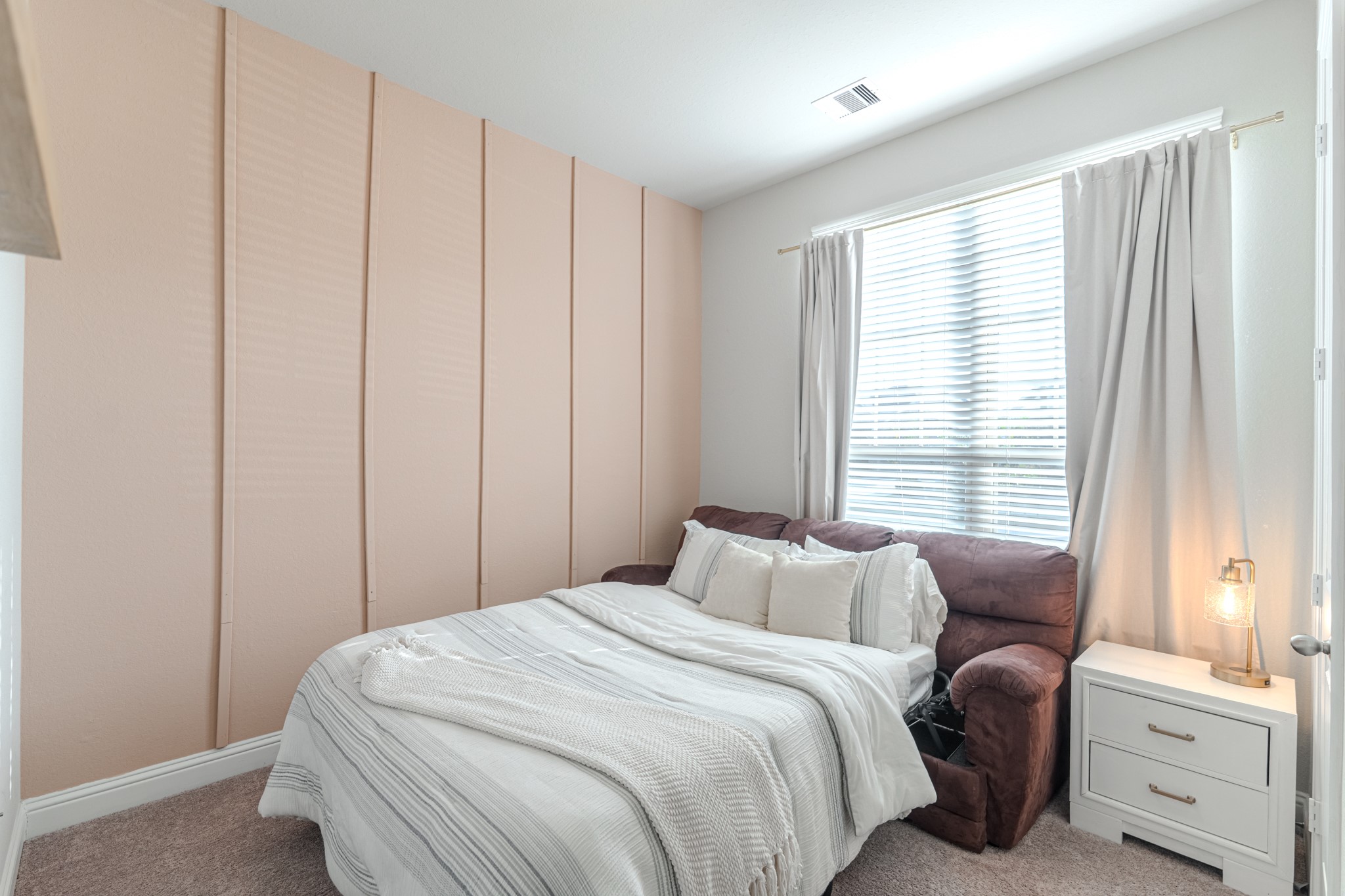 17310 Autumn Sage Court Conroe, TX 77385 - Photo 27 of 31 a bedroom with a bed and a window