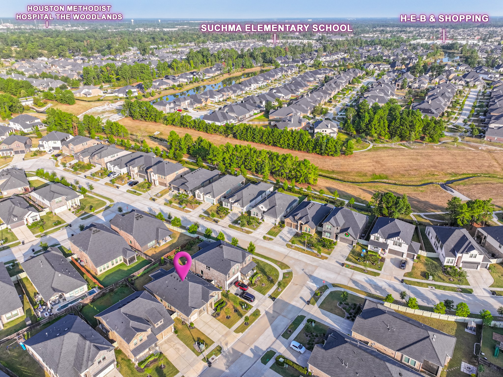 17310 Autumn Sage Court Conroe, TX 77385 - Photo 3 of 31 an aerial view of a city with streets and houses