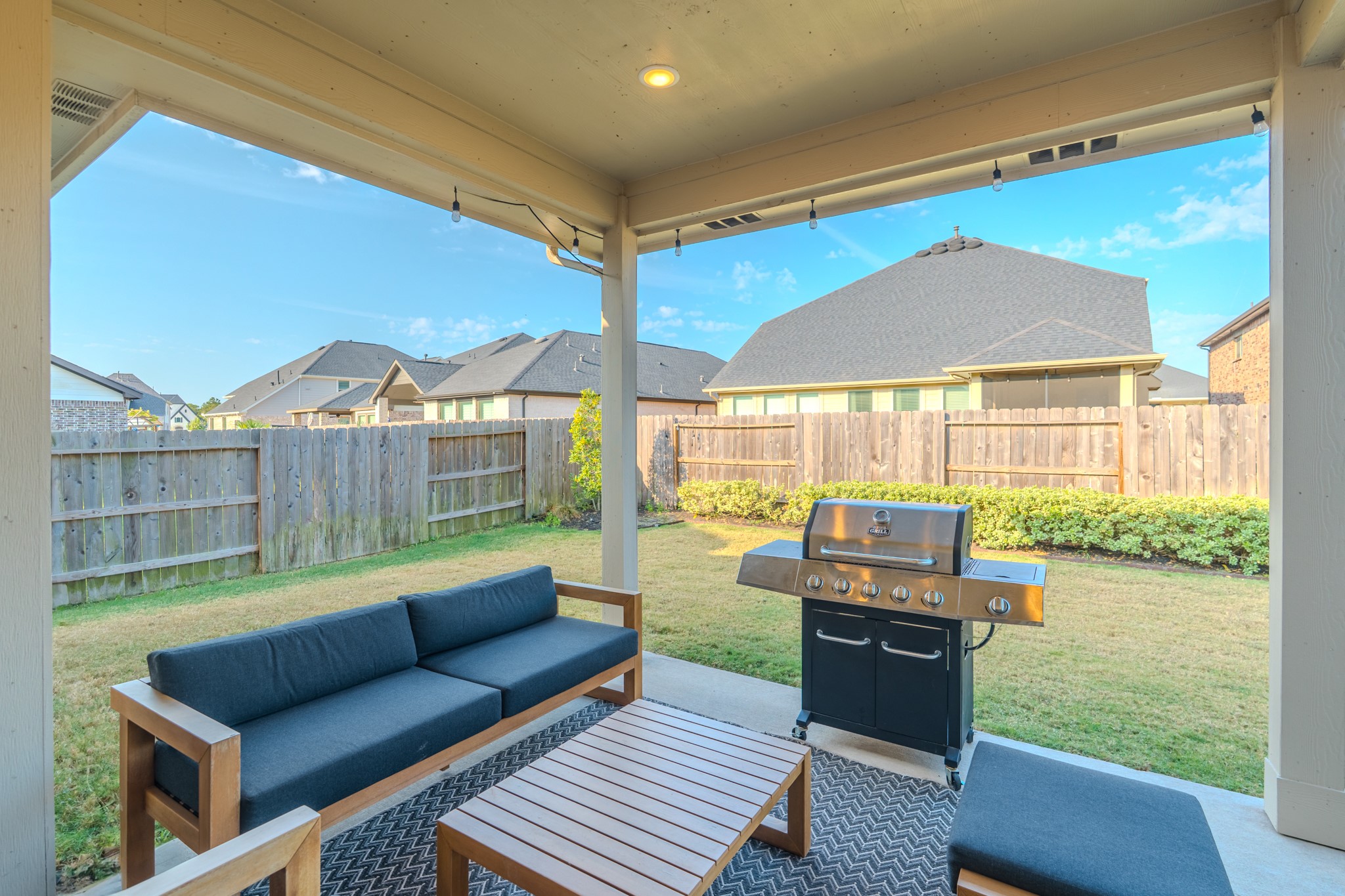 17310 Autumn Sage Court Conroe, TX 77385 - Photo 31 of 31 a living room with furniture and a floor to ceiling window