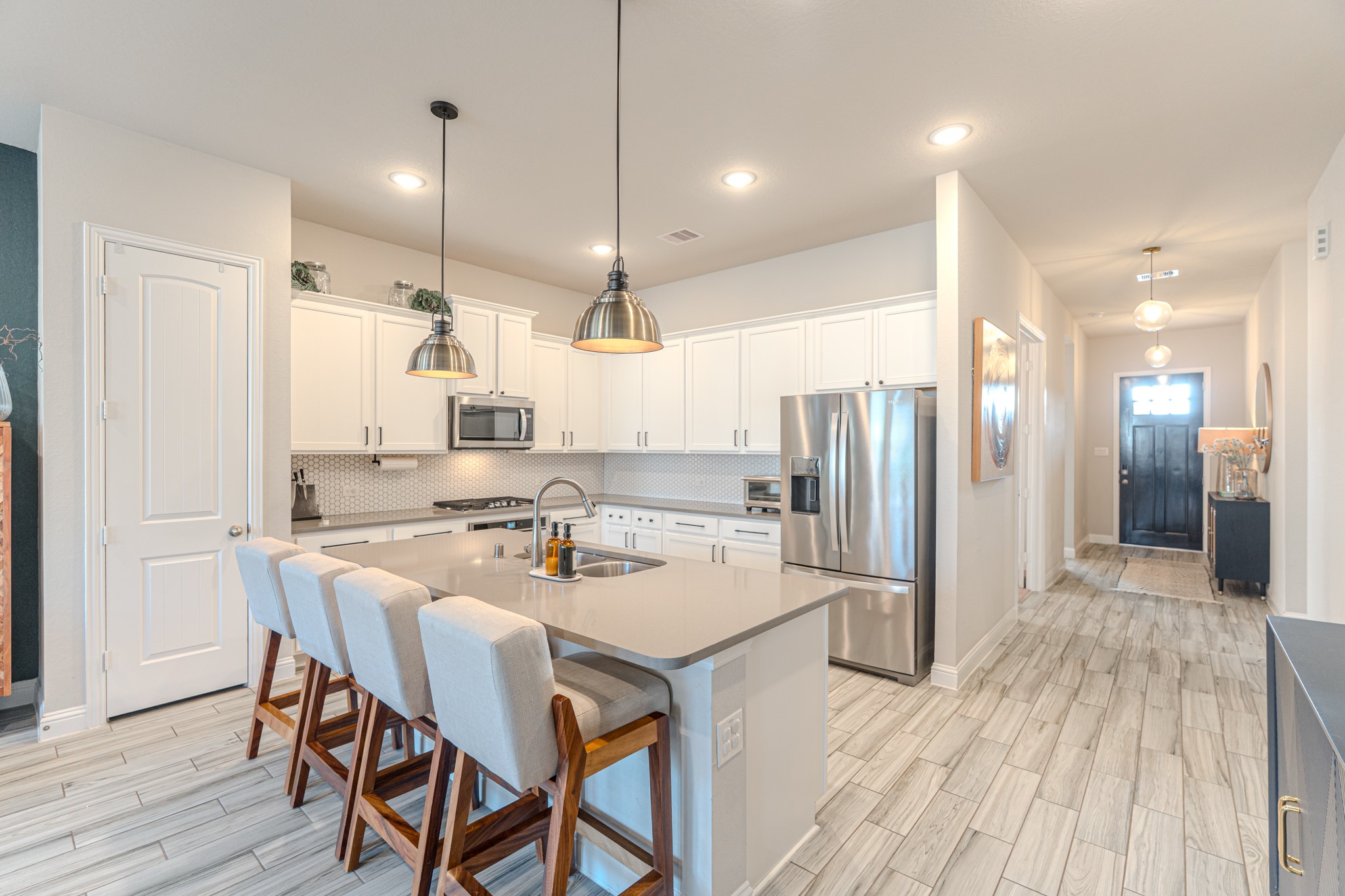 17310 Autumn Sage Court Conroe, TX 77385 - Photo 10 of 31 a large kitchen with a table and chairs
