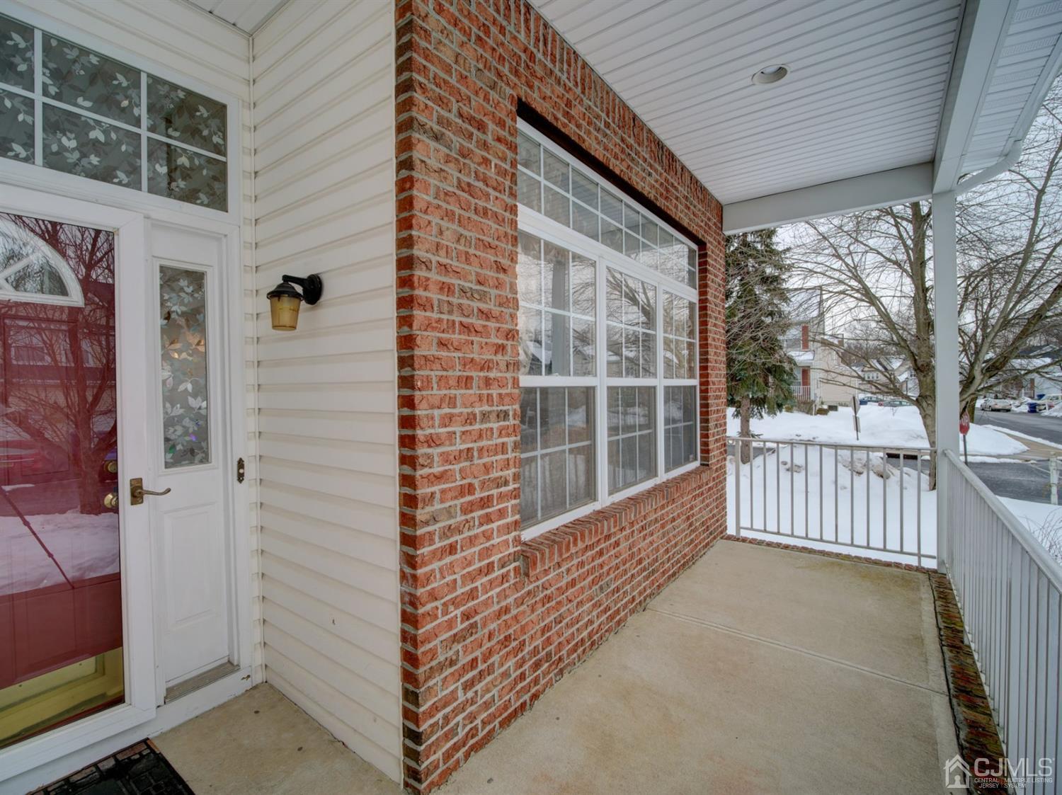 35 Springfield Road North Brunswick, NJ 08902 - Photo 3 of 42 a view of a porch with wooden floor and fence