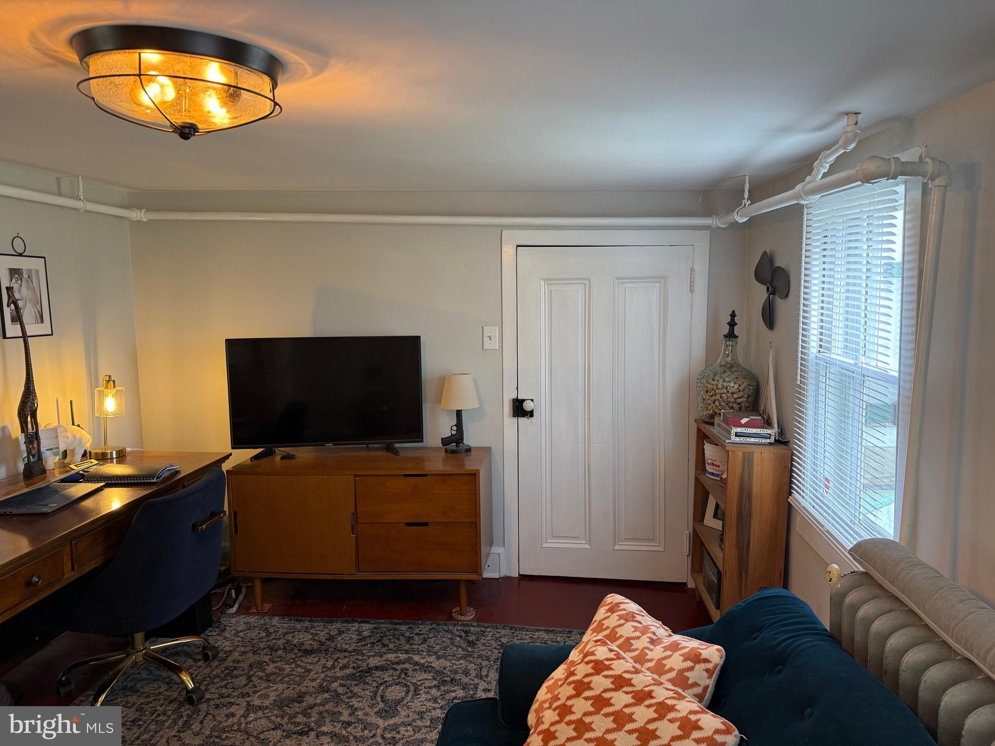 303 Baptist Road Newport, NJ 08345 - Photo 19 of 42 a living room with furniture and a flat screen tv