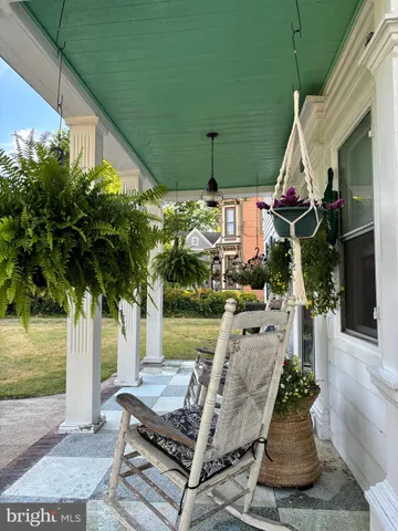 a house view with swimming pool in front of it