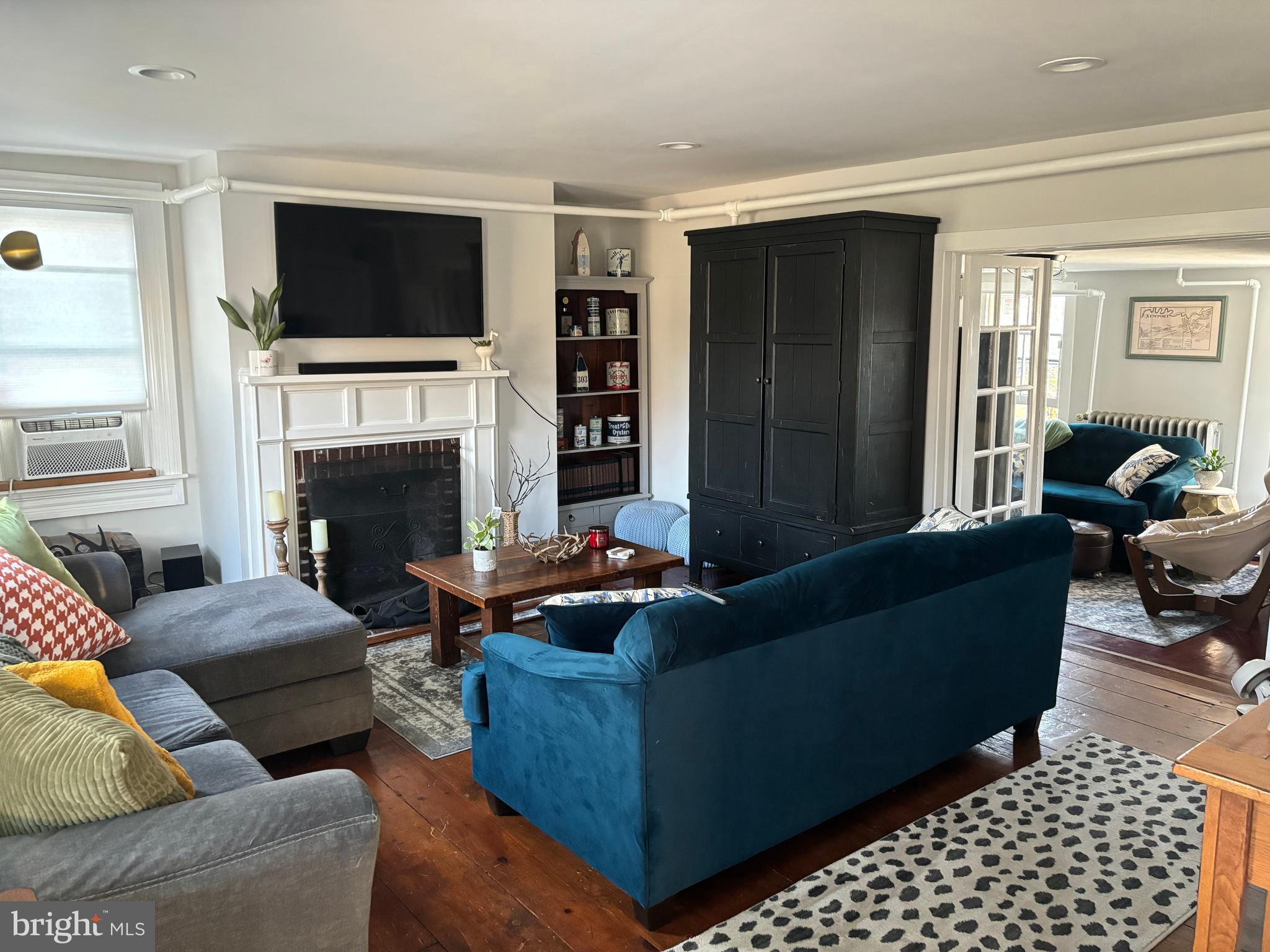 303 Baptist Road Newport, NJ 08345 - Photo 5 of 42 a living room with furniture and a fireplace