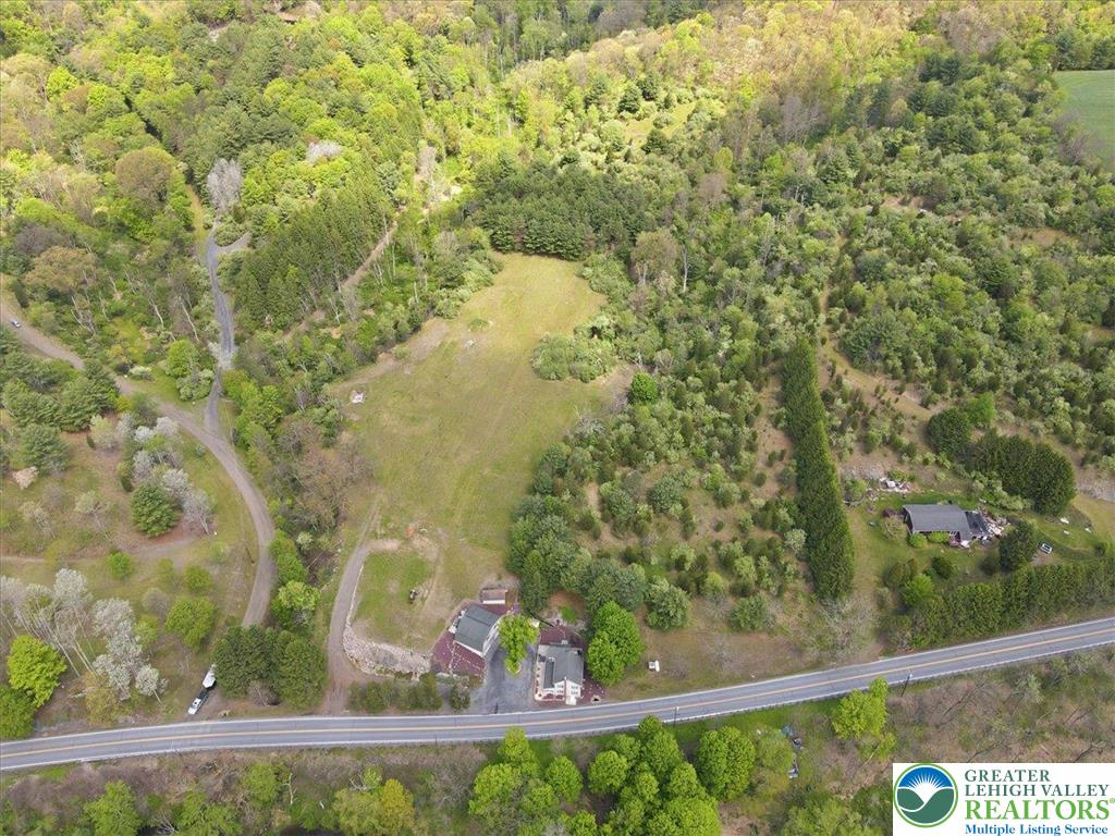 4880 Little Gap Road Kunkletown, PA 18058 - Photo 100 of 100 This expansive aerial view showcases a property nestled amidst lush natural surroundings and easy road access.