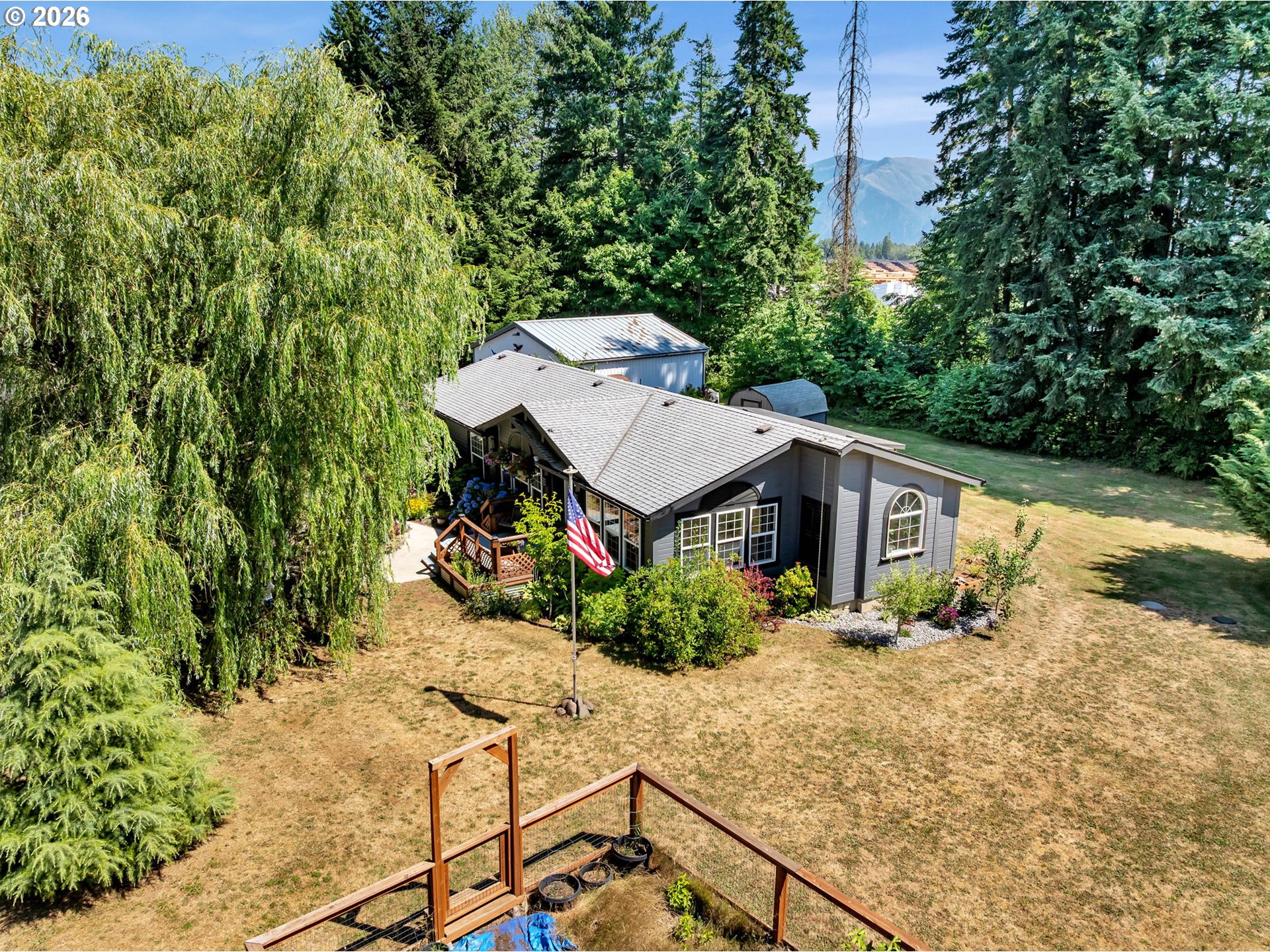 a view of a house with wooden fence