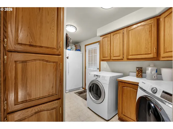 a utility room with dryer and washer