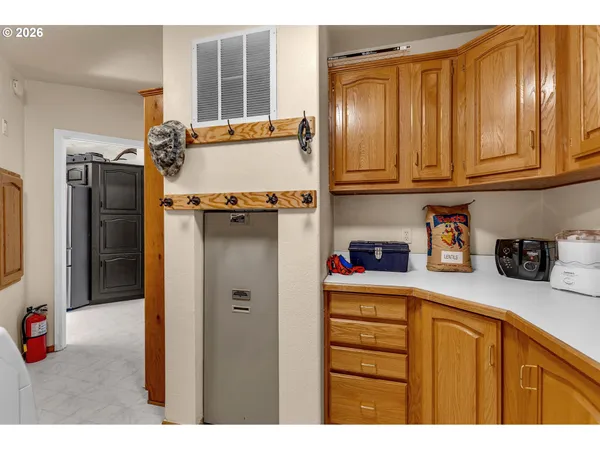 a kitchen with stainless steel appliances granite countertop a refrigerator and cabinets