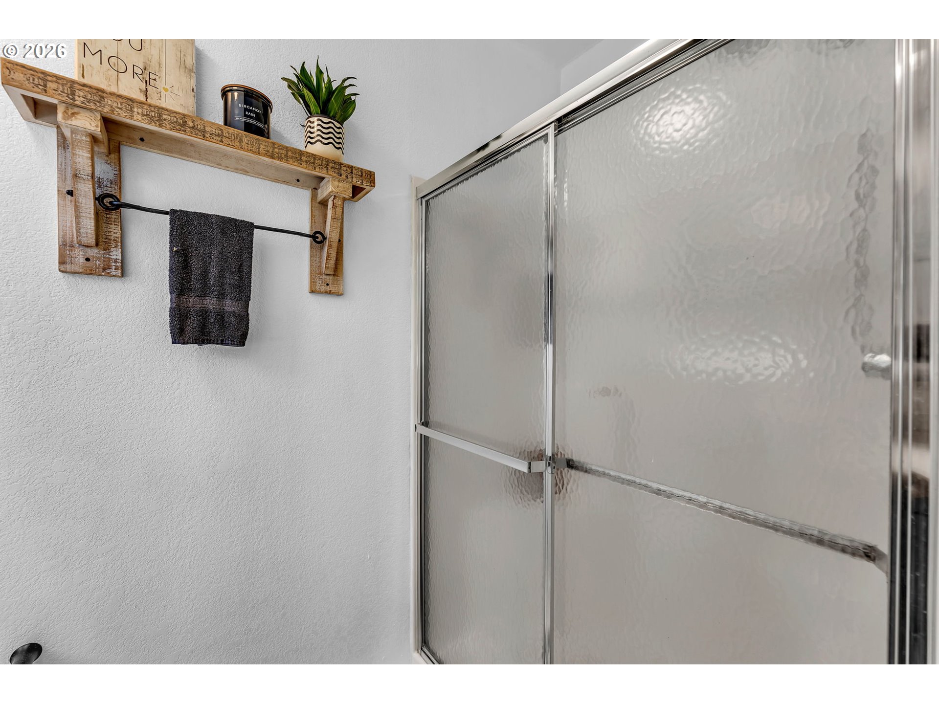 52 Estabrook Loop Carson, WA 98610 - Photo 24 of 37 a bathroom with a shower and a mirror