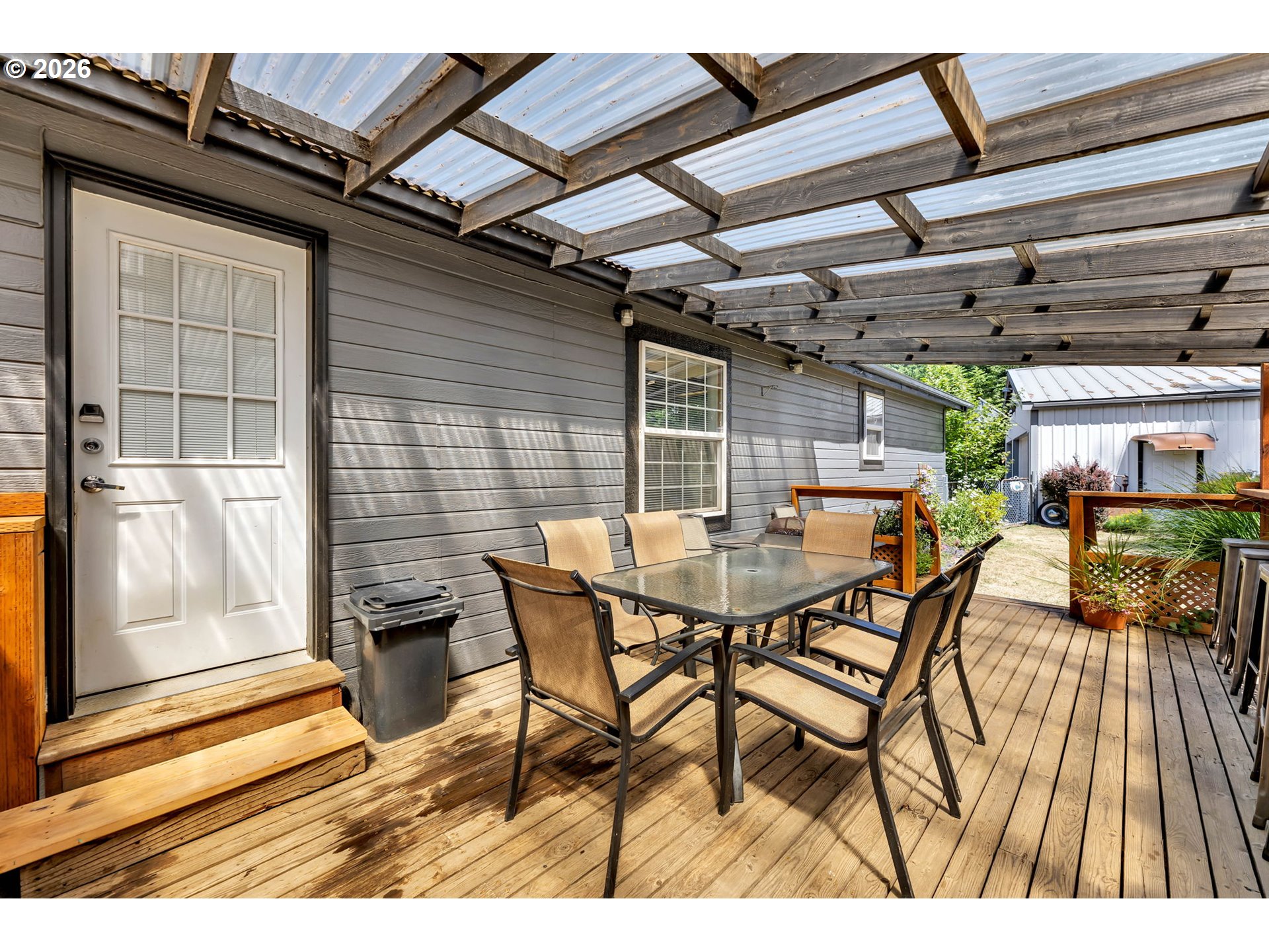 52 Estabrook Loop Carson, WA 98610 - Photo 26 of 37 a view of a patio with table and chairs with wooden floor