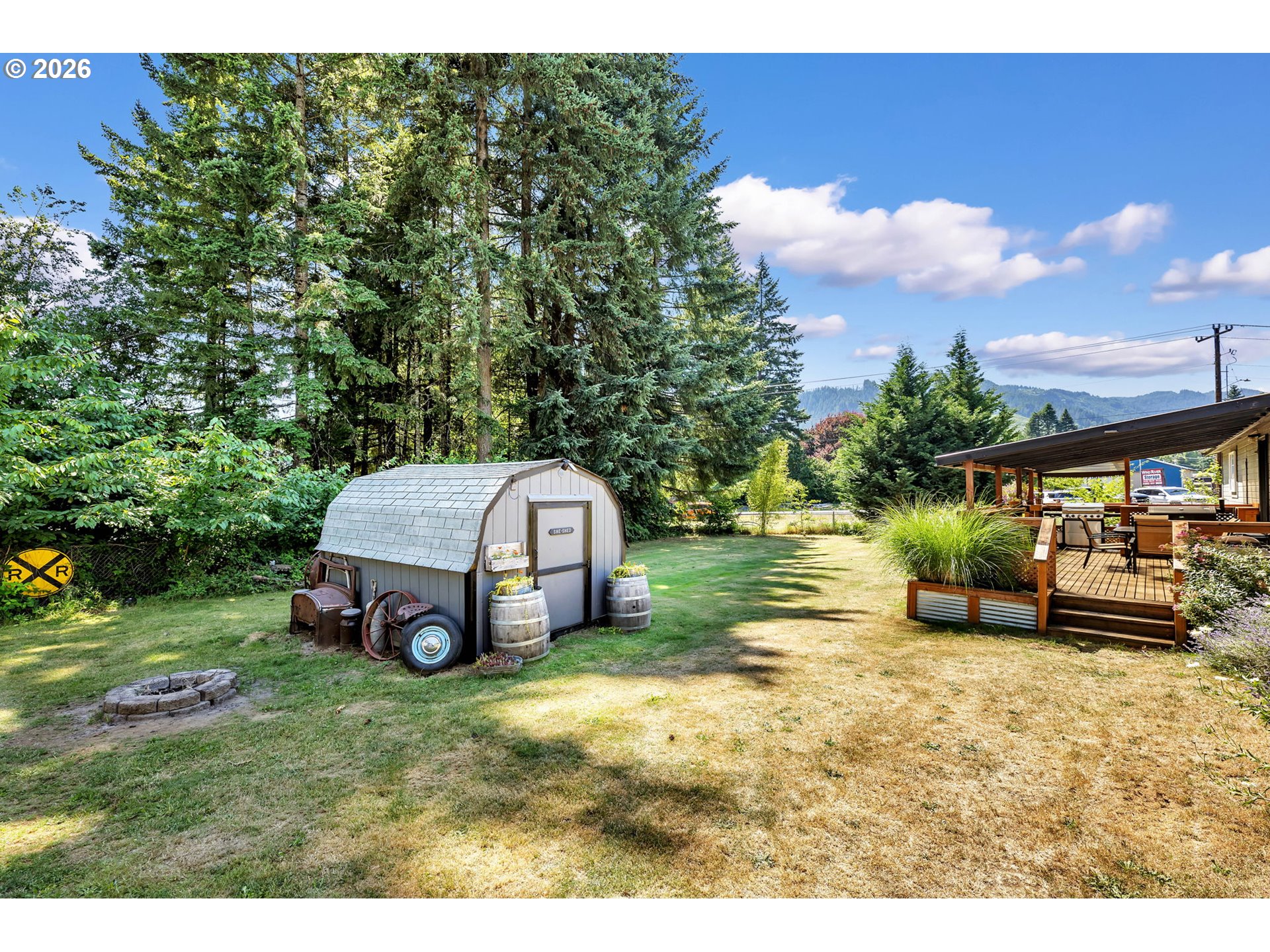52 Estabrook Loop Carson, WA 98610 - Photo 30 of 37 a view of a house with a yard and sitting area