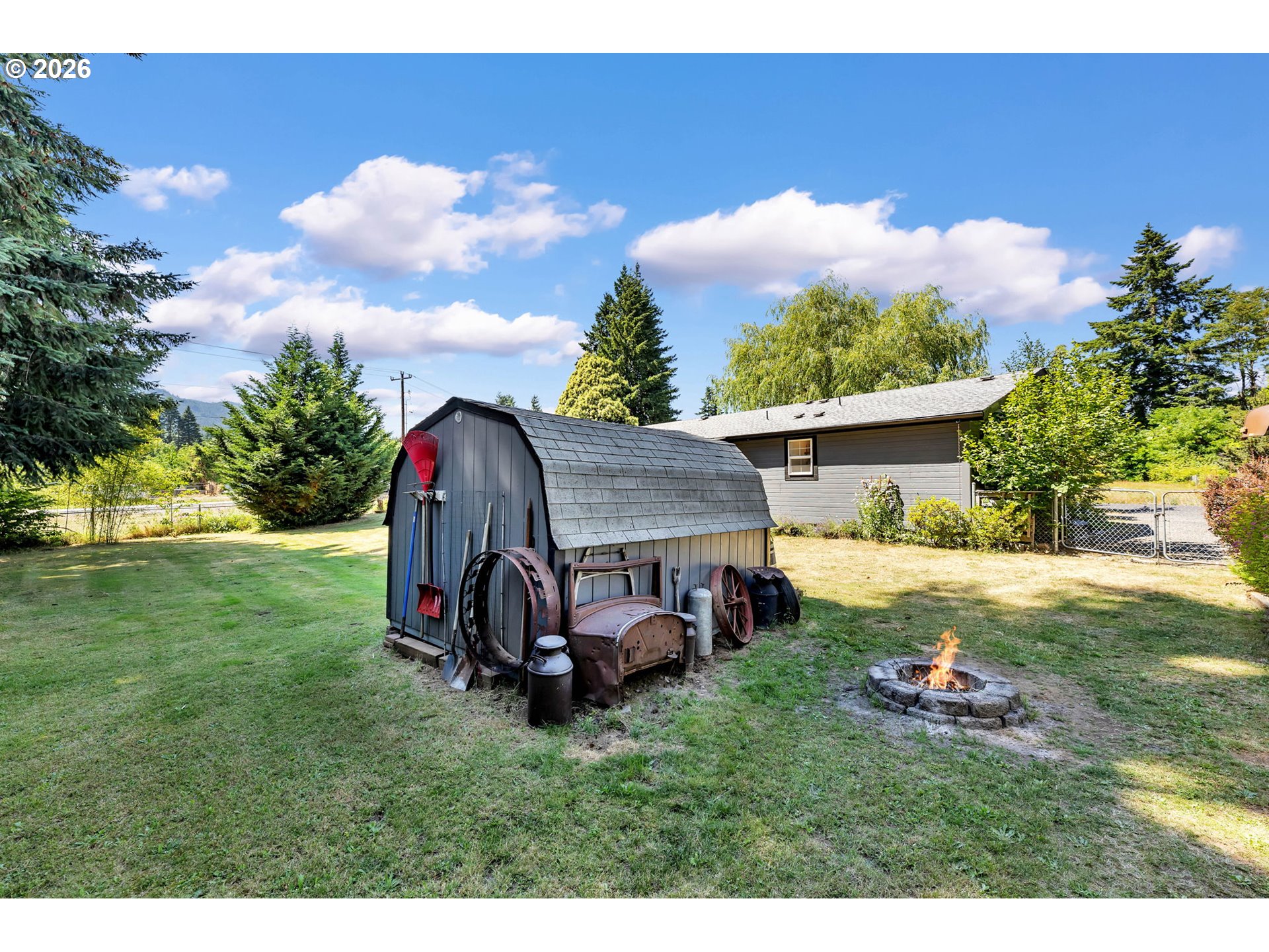 52 Estabrook Loop Carson, WA 98610 - Photo 31 of 37 a view of backyard with table and chairs and potted plants