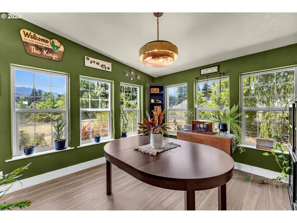 a view of a dining room with furniture window and outside view