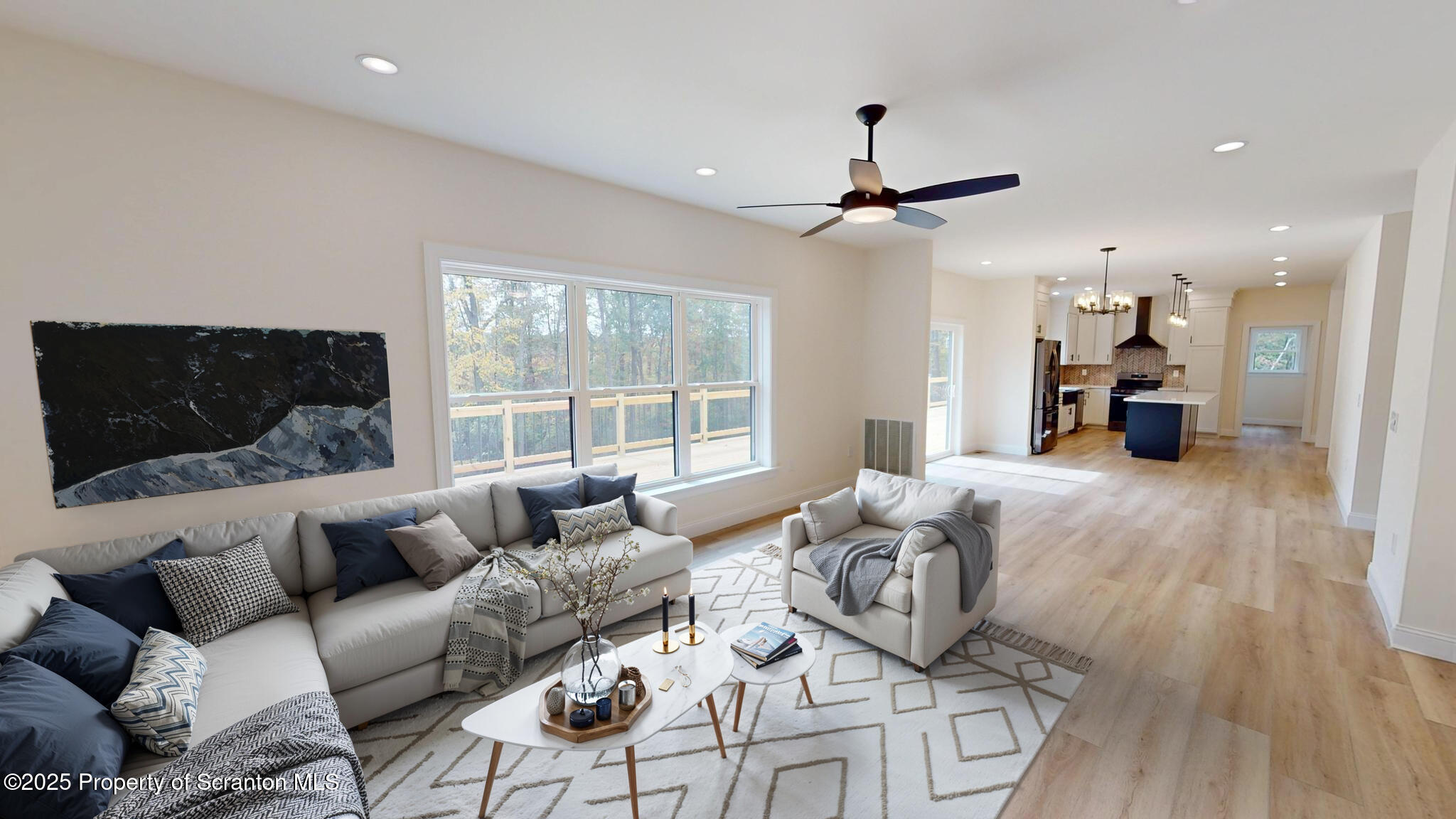 99 Woodland Drive Lake Ariel, PA 18436 - Photo 11 of 124 a living room with furniture and a flat screen tv
