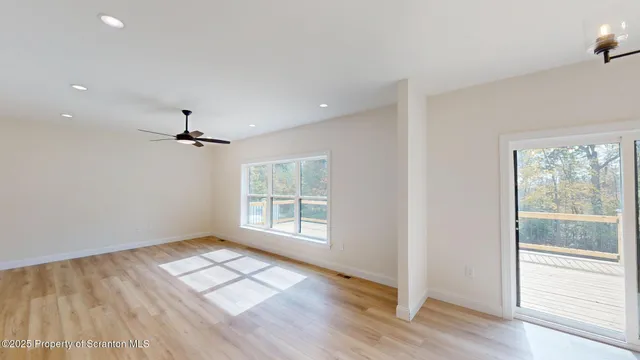 a spacious bedroom with a bed and a chair