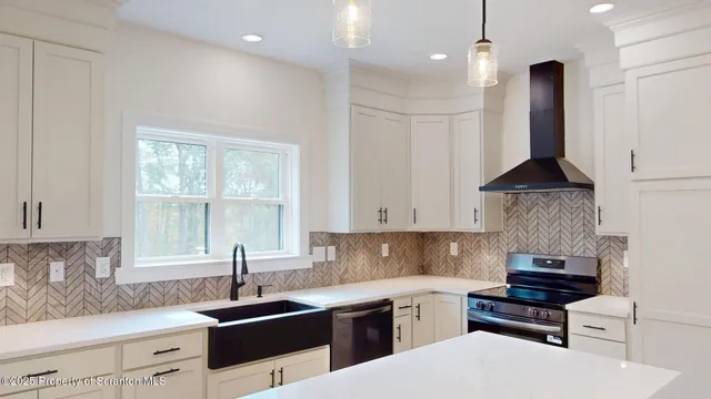 a view of an empty room with wooden walls