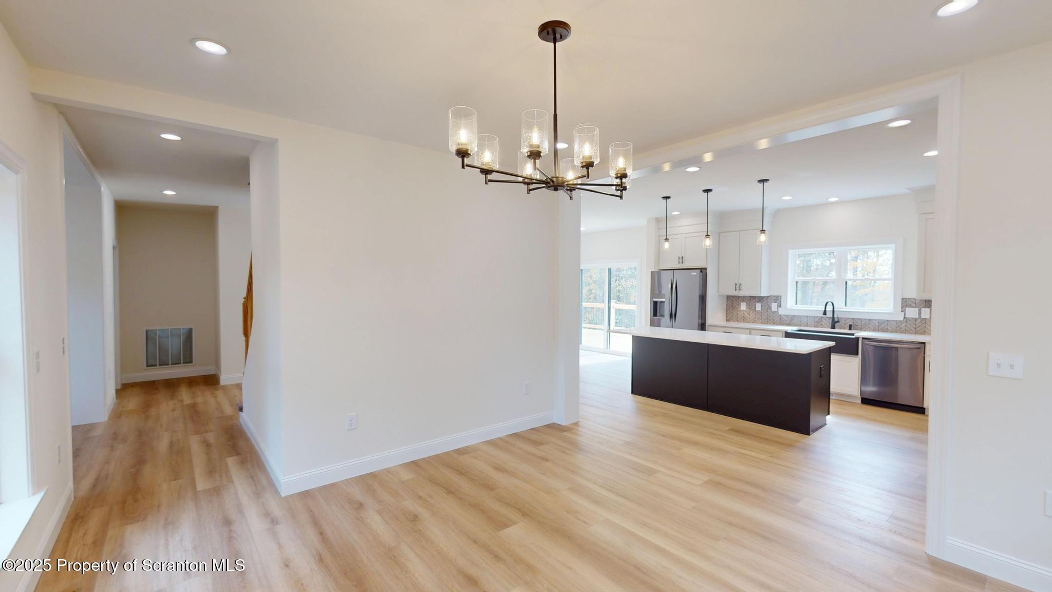 99 Woodland Drive Lake Ariel, PA 18436 - Photo 44 of 124 a large kitchen with sink a refrigerator and wooden floor
