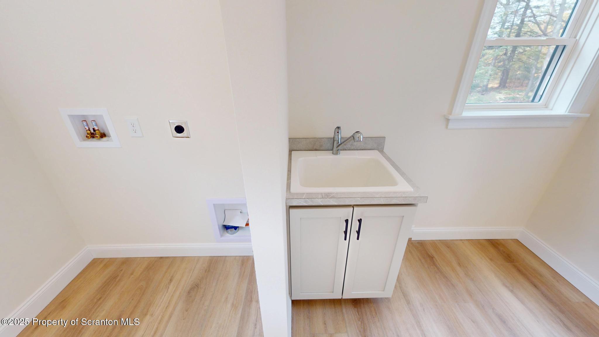 99 Woodland Drive Lake Ariel, PA 18436 - Photo 46 of 124 a bathroom with a sink and a window