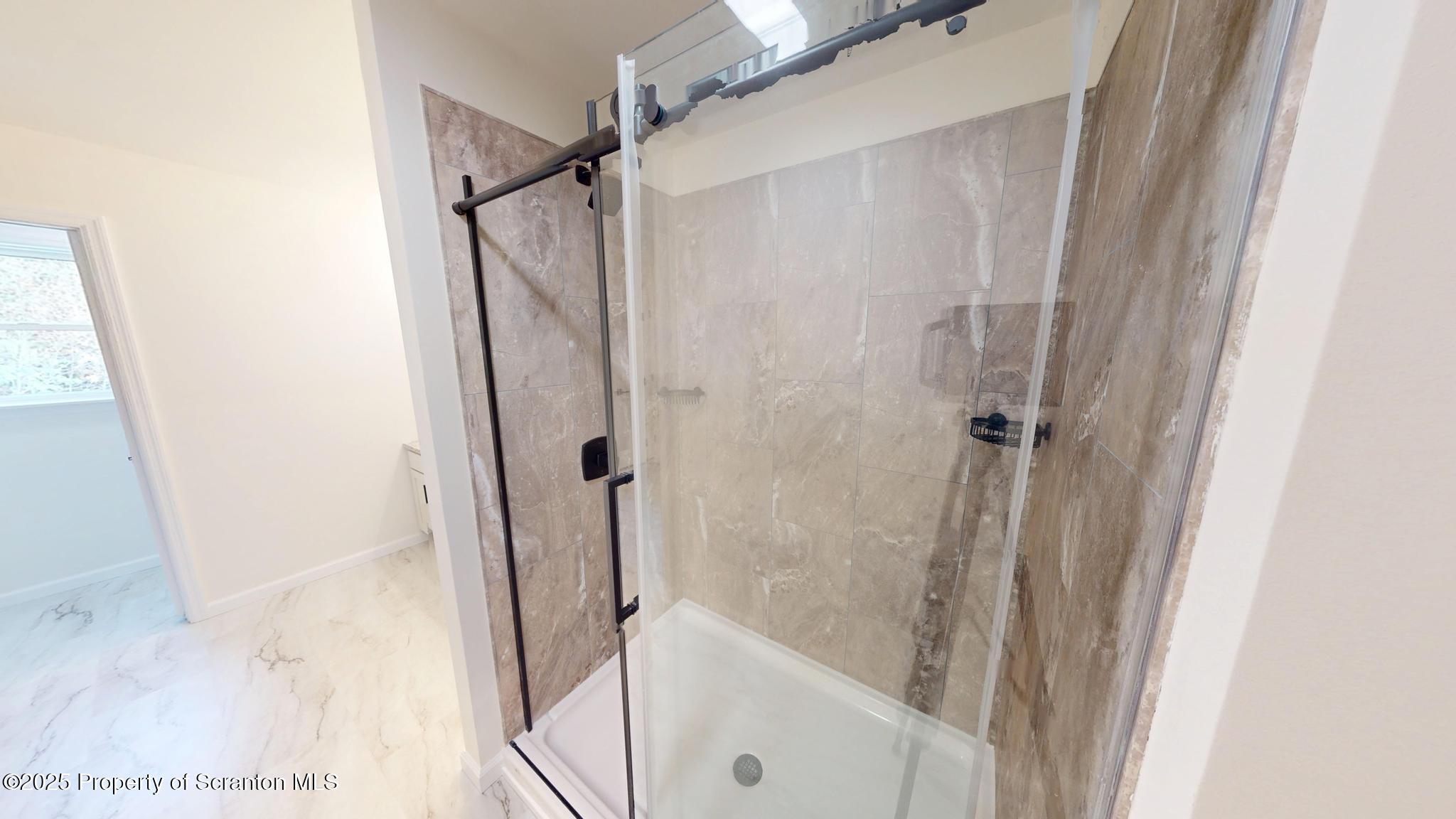 99 Woodland Drive Lake Ariel, PA 18436 - Photo 86 of 124 a bathroom with a shower and a glass door